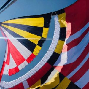 Maryland flag spinnaker sail on Alyosha catamaran during ocean sailing